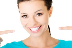 beautiful casual woman showing her perfect white teeth.